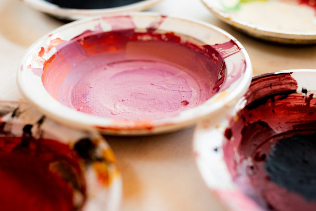 white and red ceramic bowl